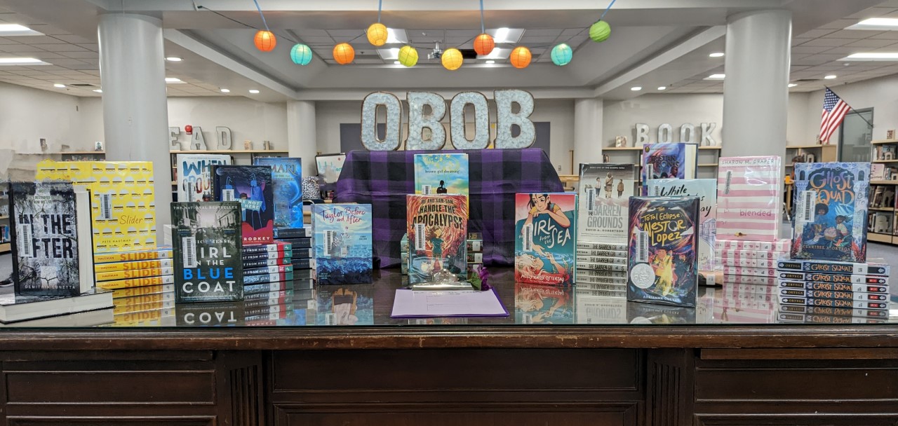 Oregon Battle of the Books sign with library books