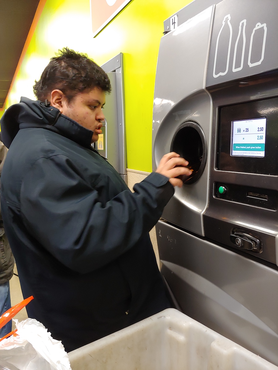 Student working at bottle drop
