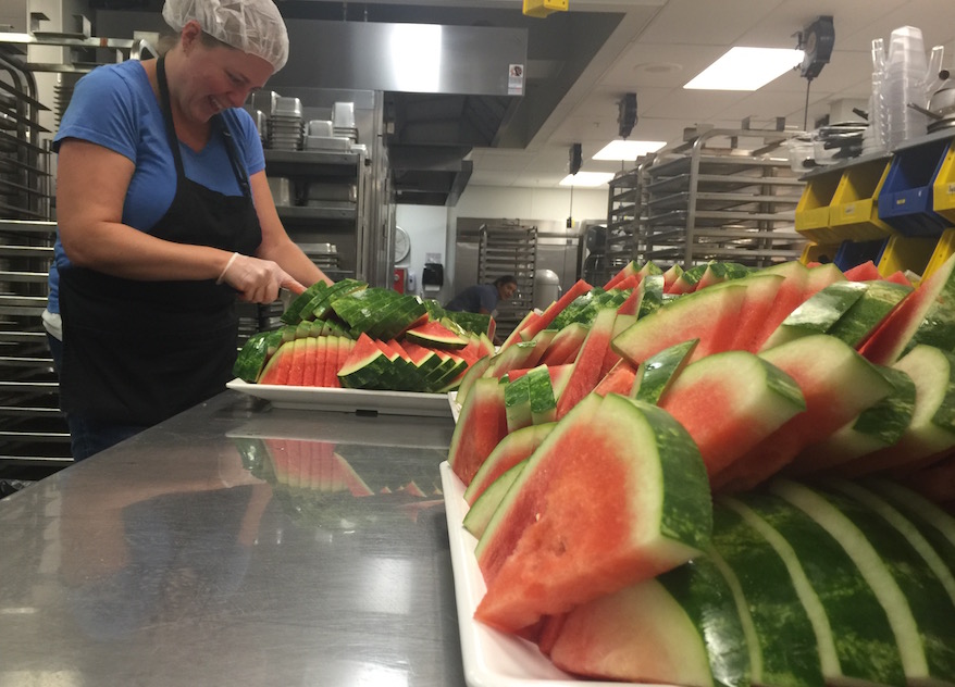 Nutrition services slicing watermelon