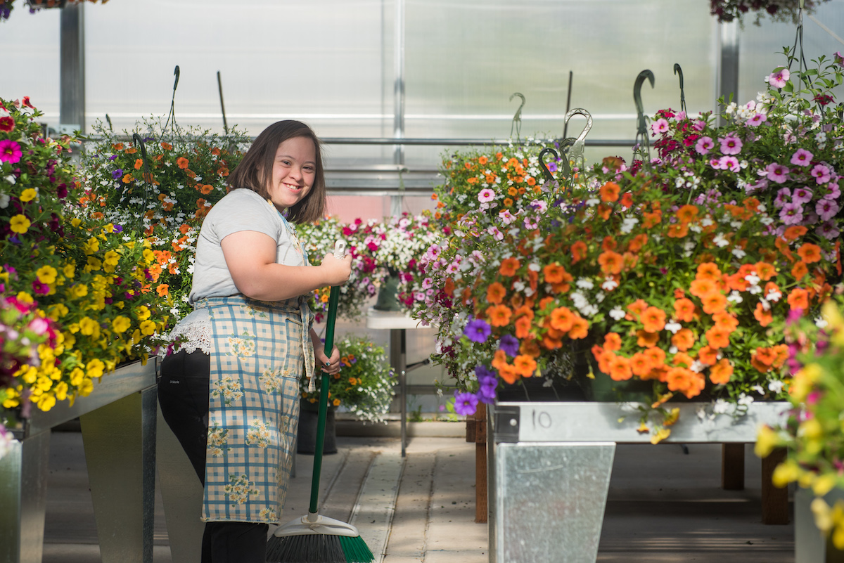 Student works in greenhouse