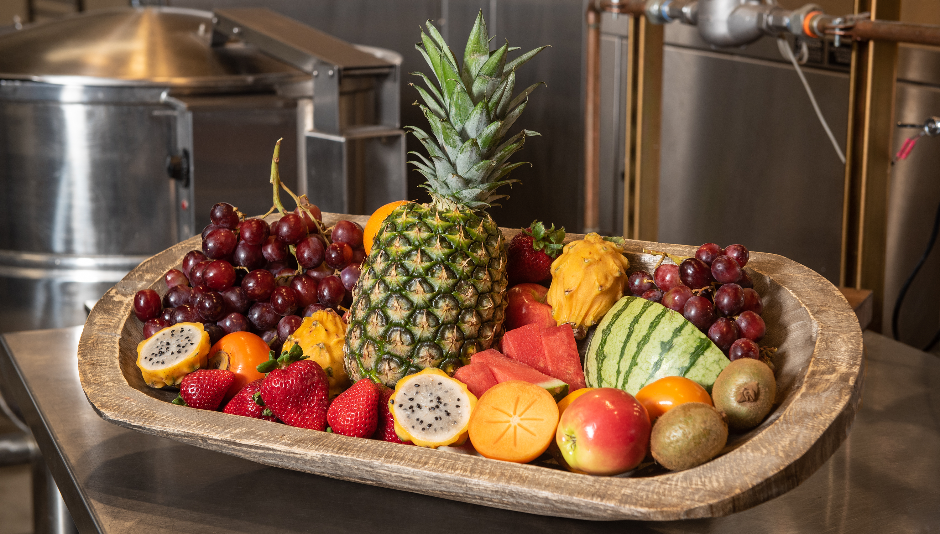 basket filled with fruit including giant pineapple