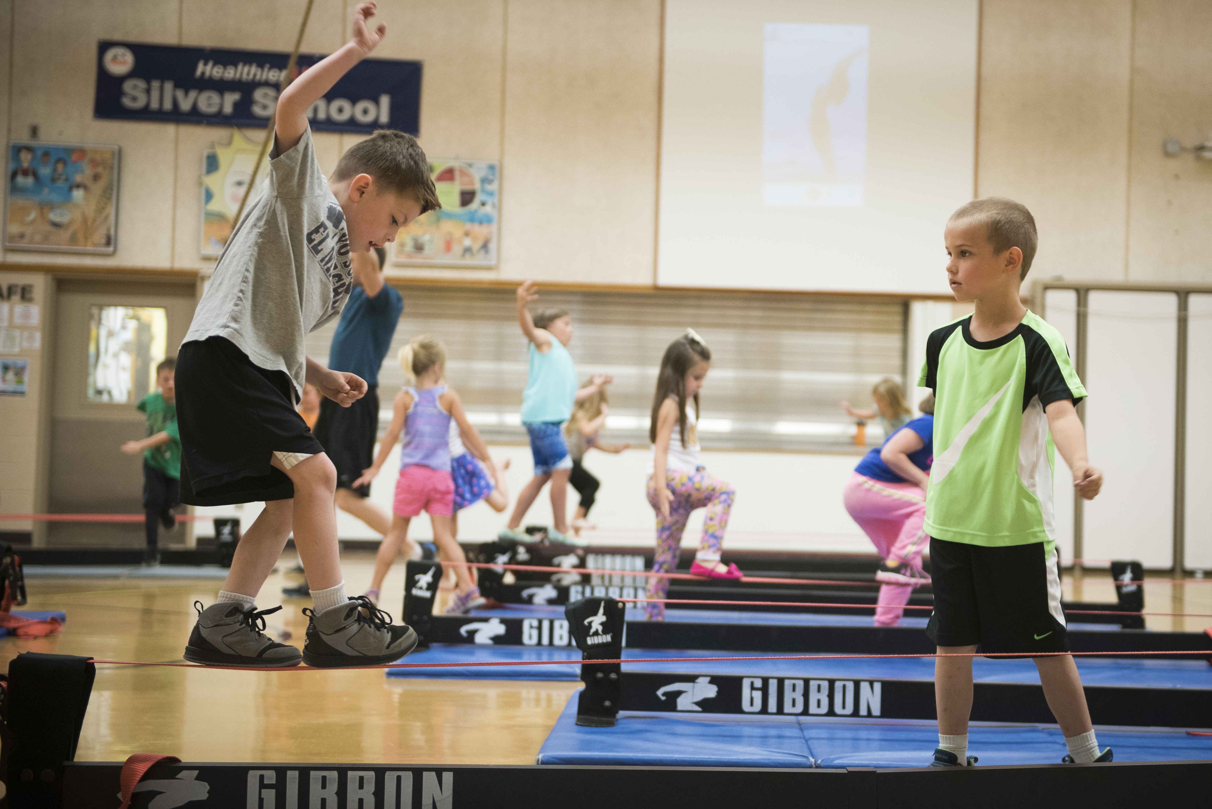 Children walking on a slackline