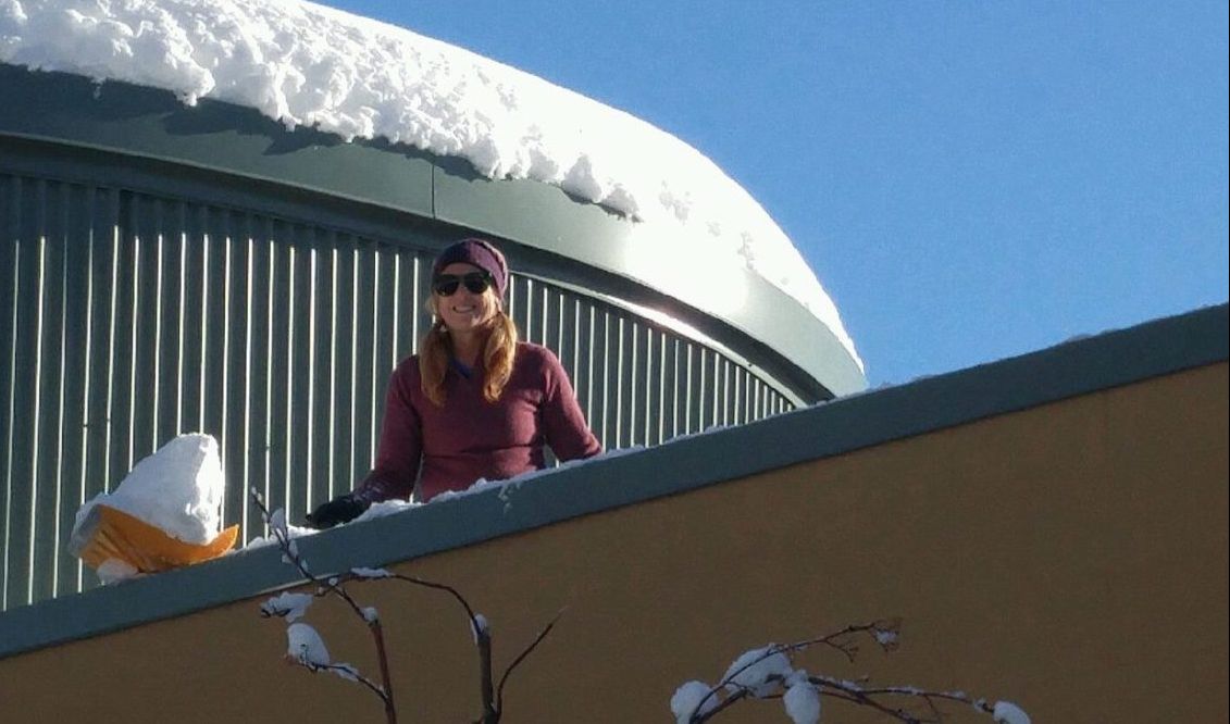Westside Village Magnet principal Wendy Winchel Removing Snow